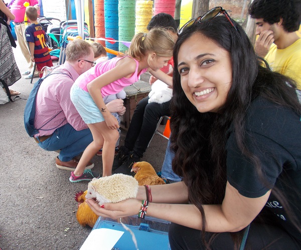 guinea pigs, hedgehogs, mini-lop rabbits, and Pekin Bantam chickens meet children who want to pet them
